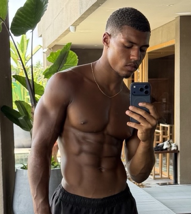 Christian after: lean with visible abs, broad shoulders and a v-taper